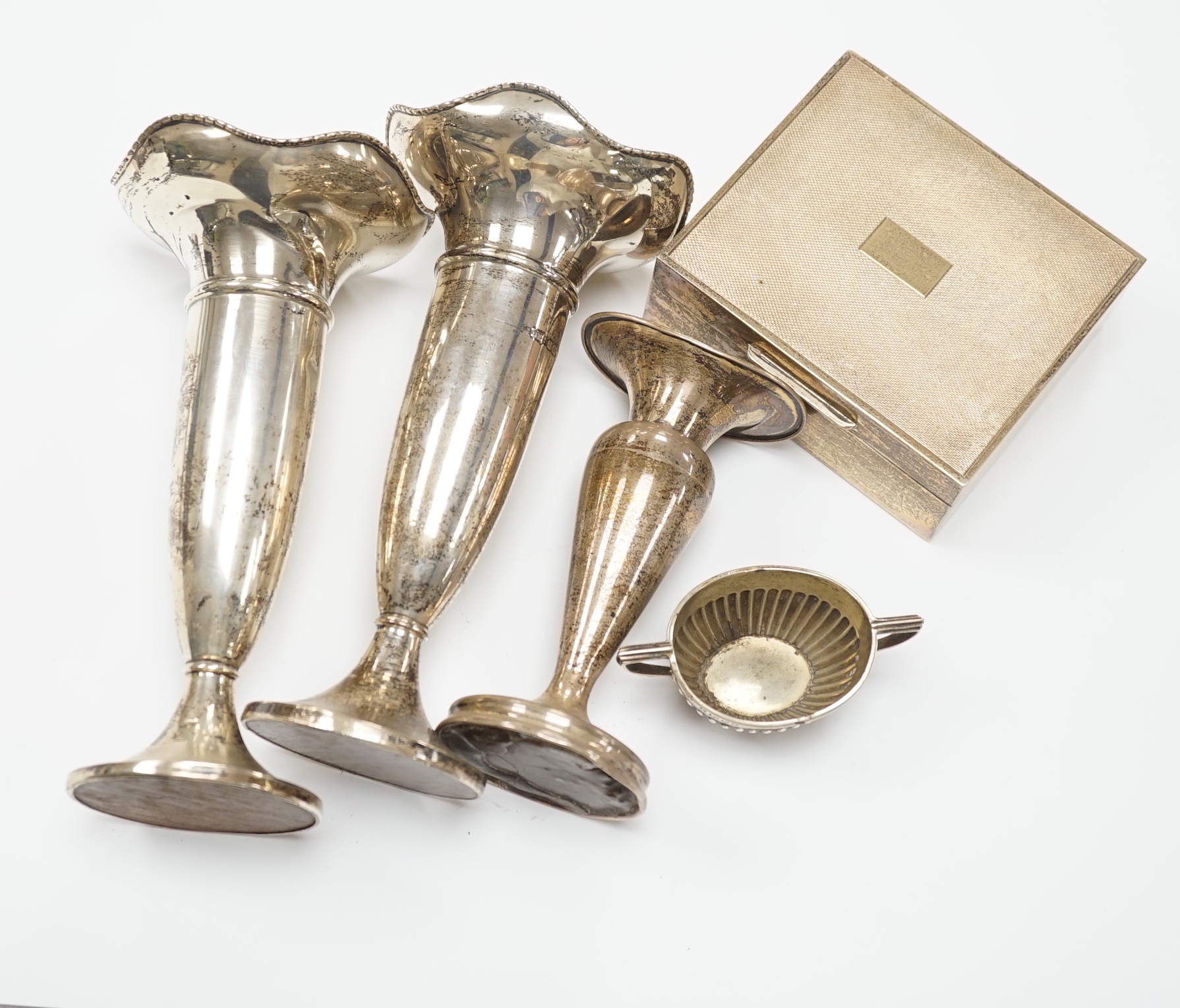 A pair of George V silver mounted posy vases, Birmingham, 1919, 17.3cm, a similar smaller vase, a silver mounted cigarette box and a small silver two handled oval salt.